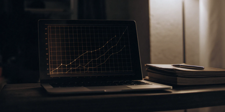 Business Line of Credit: Everything You Need to Know 12 Business line of credit tools: laptop, notebook, and pen.