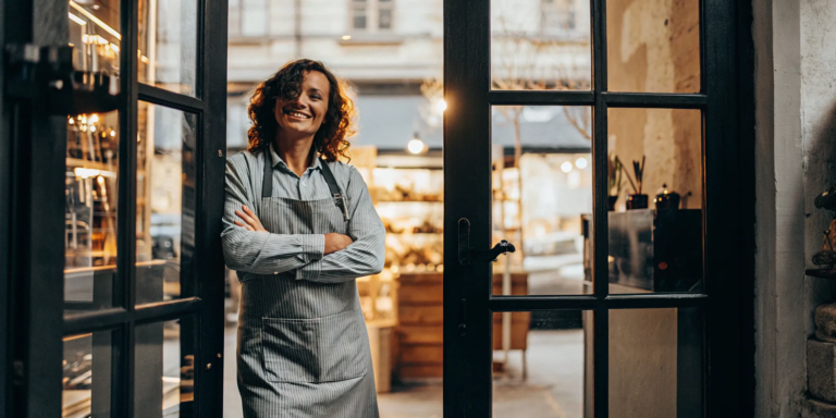 Business owner with apron, securing funding despite bad credit.
