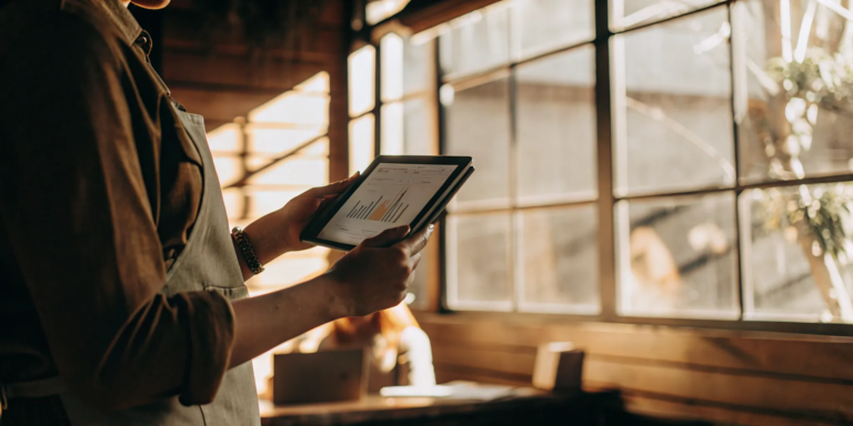 Merchant reviews cash advance terms on tablet.