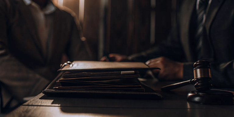 A merchant considers the legal issues of a cash advance contract with a gavel on the desk.