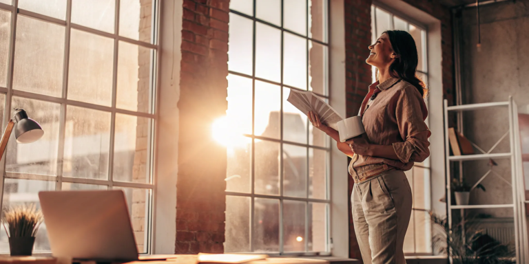 Businesswoman reviewing paperwork for factoring receivables without recourse.