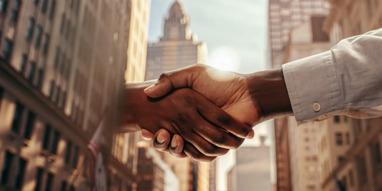 Fast Working Capital: The Ultimate SMB Guide 10 A business handshake securing a fast working capital loan in New York City.