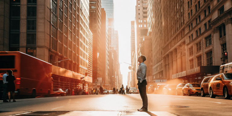 How to Get Business Funding with Bad Credit in NYC 4 Businessman on a busy New York City street considering bad credit business funding options.