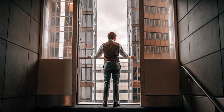 Business owner in a high-rise office considering fast working capital loans with no credit check.
